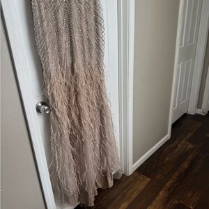 Elegant Beaded Gown with Feather Details